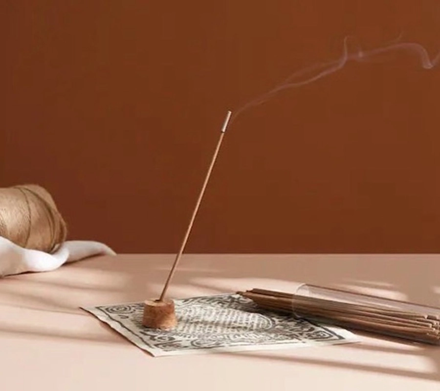 SUPERTIBET Traveler Small incense burning in a quiet meditation setting for an inner-peace ritual.