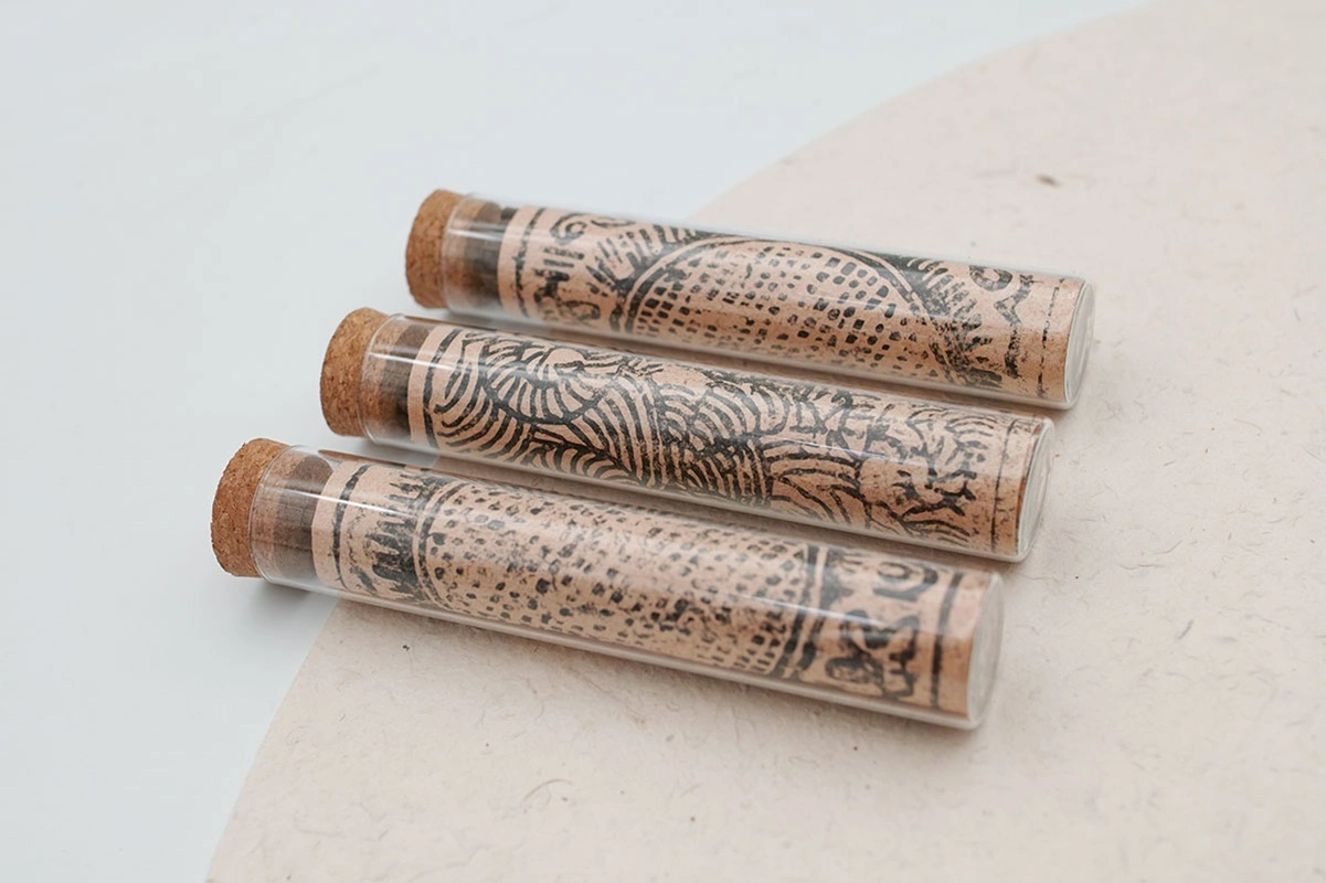 Three tubes of SUPERTIBET Traveler incense Size S lined up, showcasing the minimalist and portable design.