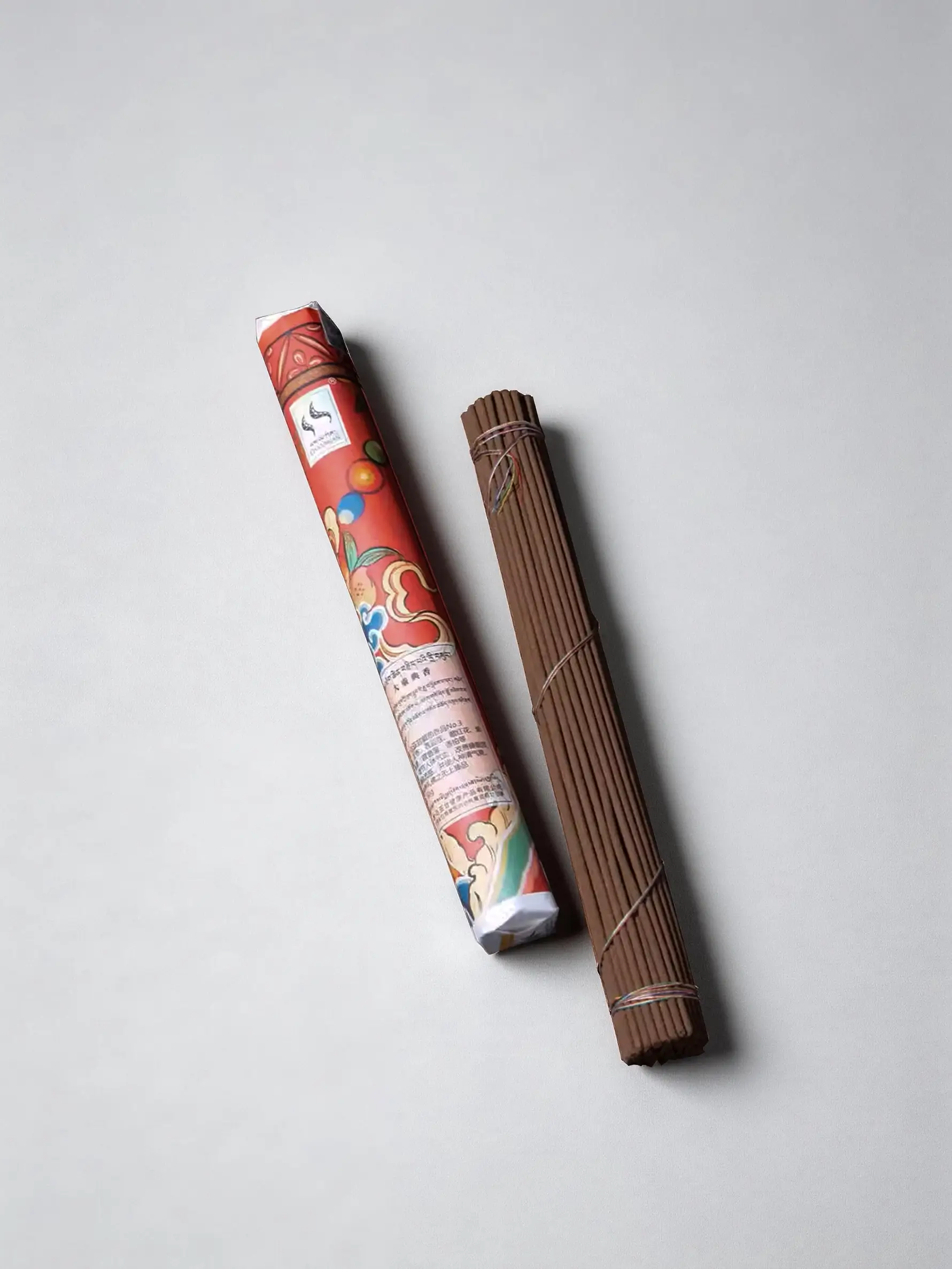 Product photo of Mahayana Tibetan incense sticks, 24.5 cm length and 80 g package.