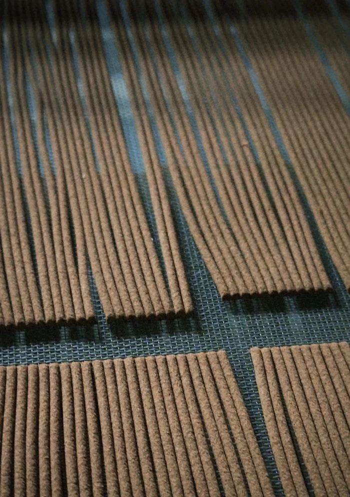 Rows of Labrang Tibetan incense sticks arranged for air-drying during production.